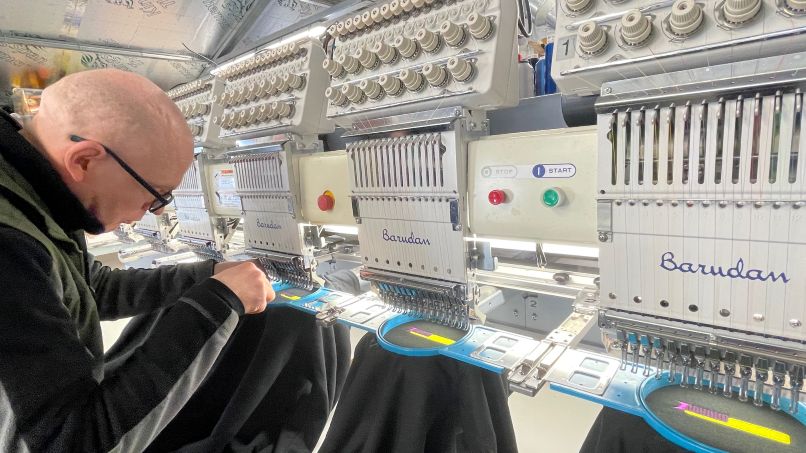 Custom embroidery machine setting up